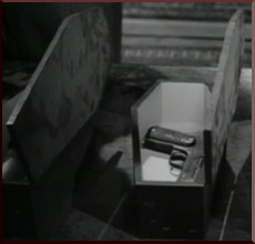 Pistol party favor in coffin